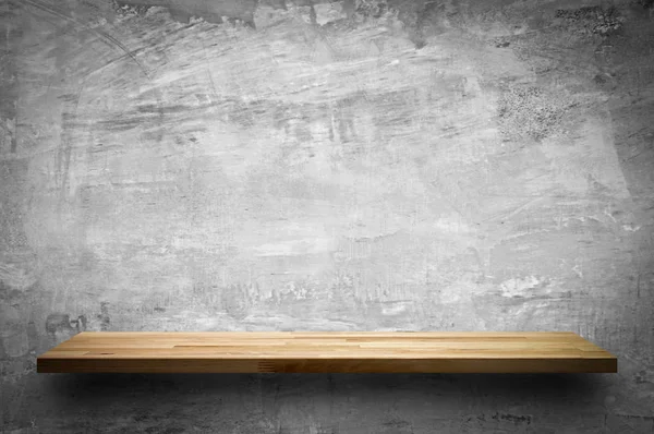 Empty wood shelf on bare concrete wall background — Stock Photo, Image