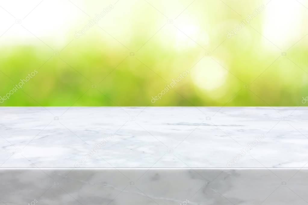 White marble stone countertop on green bokeh abstract background