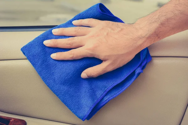 Hand cleaning interior car door panel with microfiber cloth — Stock Photo, Image