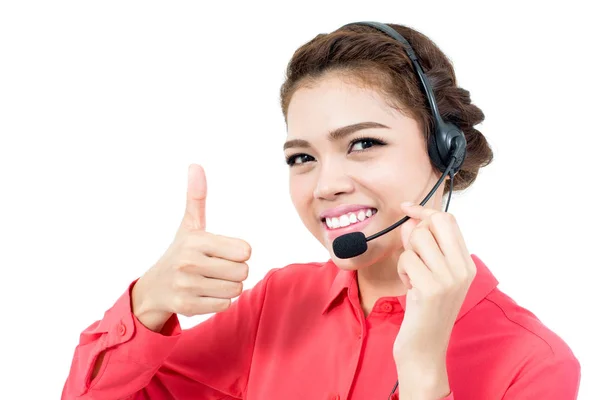 Young businesswoman  wearing microphone headset as an operator giving thumbs up — Stock Photo, Image