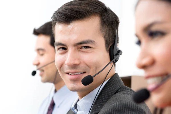 Handsome businessman as an operator in call center — Stock Photo, Image