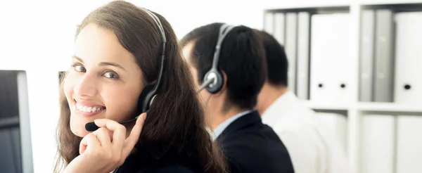 Smiling businesswoman in call center — Stock Photo, Image