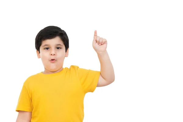 Young cute casual Asian boy pointing finger up with surprising face and mouth open — Stock Photo, Image