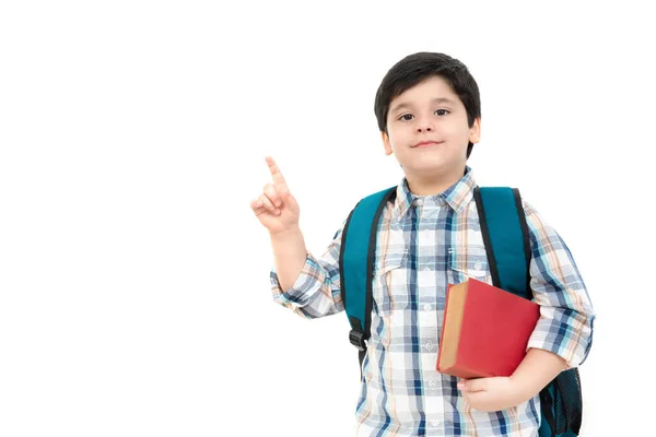 Cute little schoolboy pointing up to empty space — Stock Photo, Image