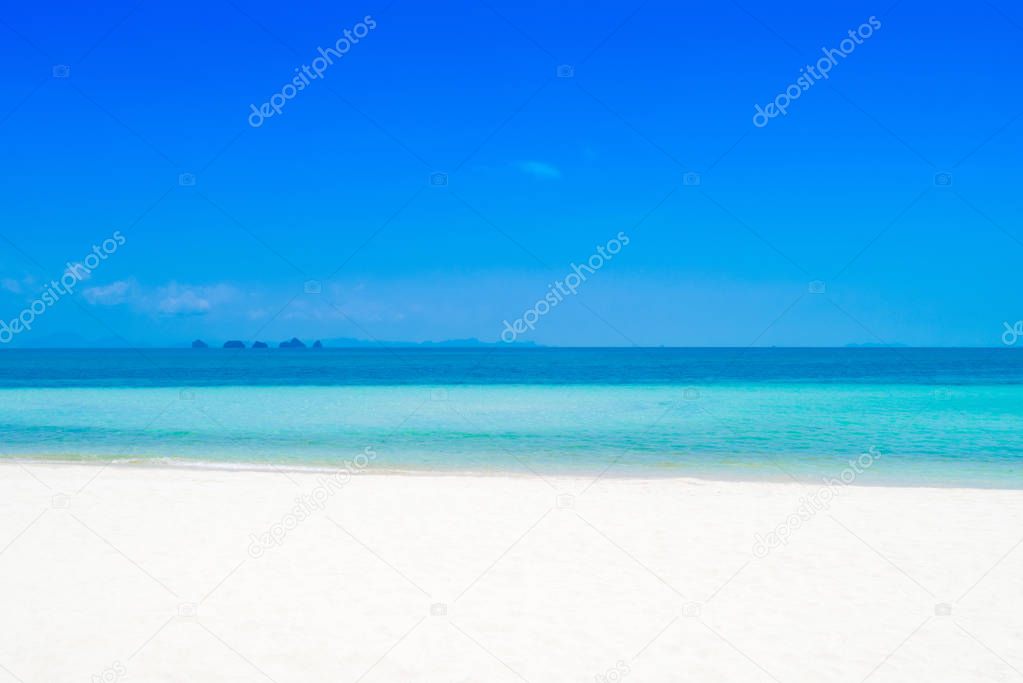 White sand beach with clear blue seawater in summer