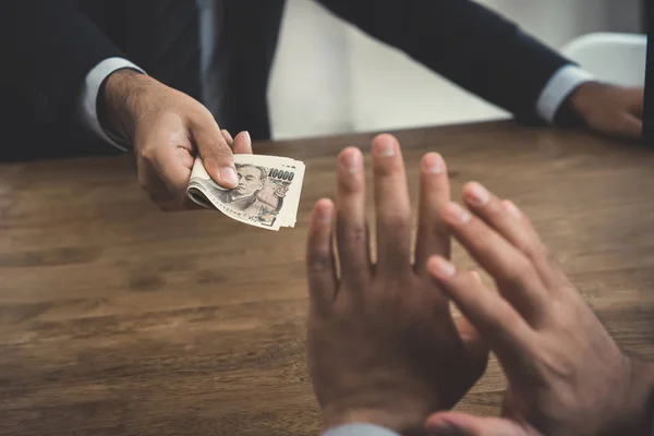 Businessman rejecting money, Japanese yen banknotes - anti bribe — Stock Photo, Image