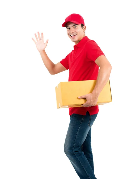Χαμογελώντας Delivery Man Κάνοντας Γεια Αντίο Χειρονομία Ενώ Κρατώντας Κουτί — Φωτογραφία Αρχείου