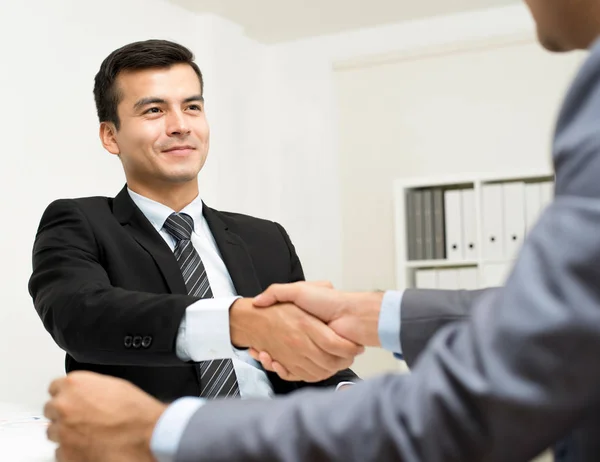Businessmen making handshake in the office — Stock Photo, Image