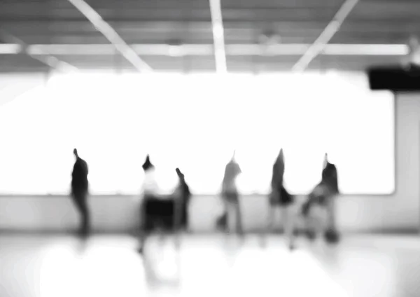 Blur fundo abstrato de pessoas dentro do terminal do aeroporto em bl — Vetor de Stock