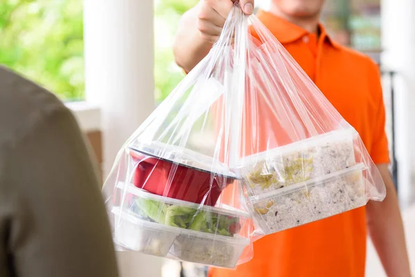 Delivery Man Giving Lunch Box Meal Bags Customer Ordered Online — Stock Photo, Image