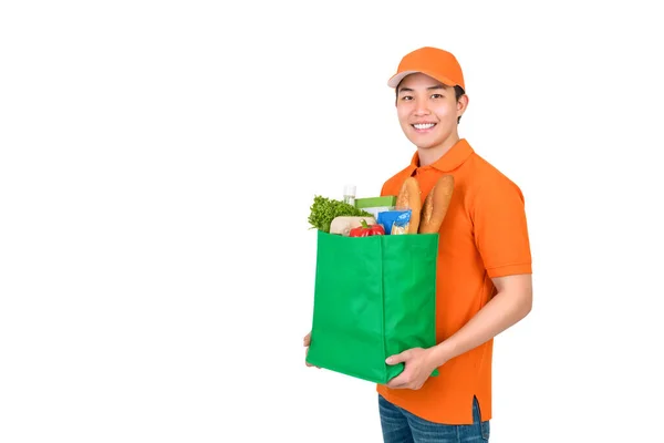 Sonriente Asiático Repartidor Hombre Llevando Comestibles Bolsa Compras Estudio Disparo —  Fotos de Stock