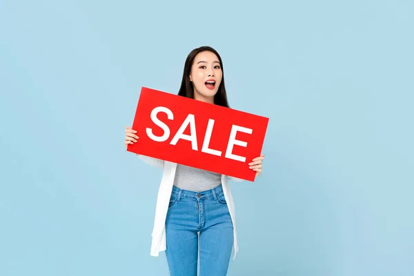 Surprised Asian Woman Holding Red Sale Sign Isolated Light Blue — Stock Photo, Image