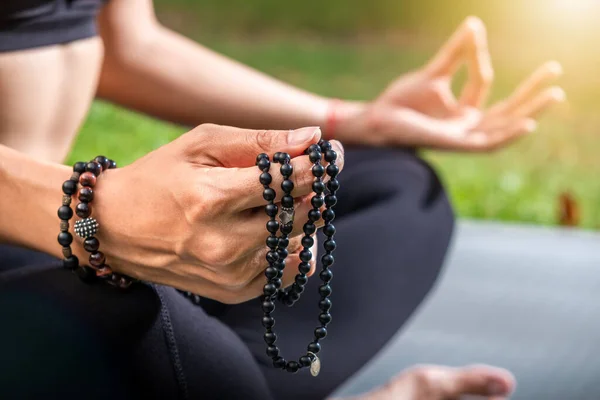 Woman in posture of Buddha during meditation. Yoga training