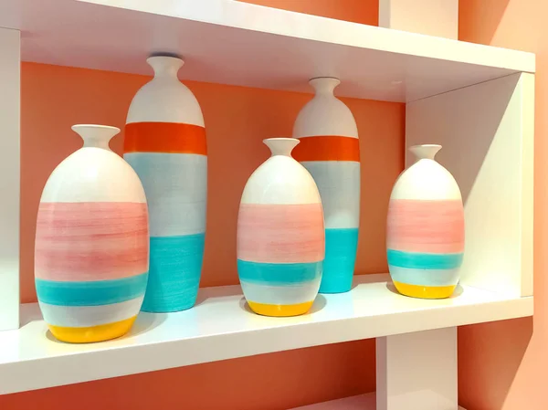 Colorful ceramic vases on a shelf — Stock Photo, Image