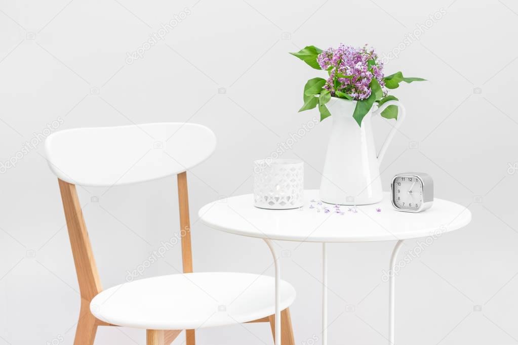 Elegant interior with a bouquet of purple lilacs