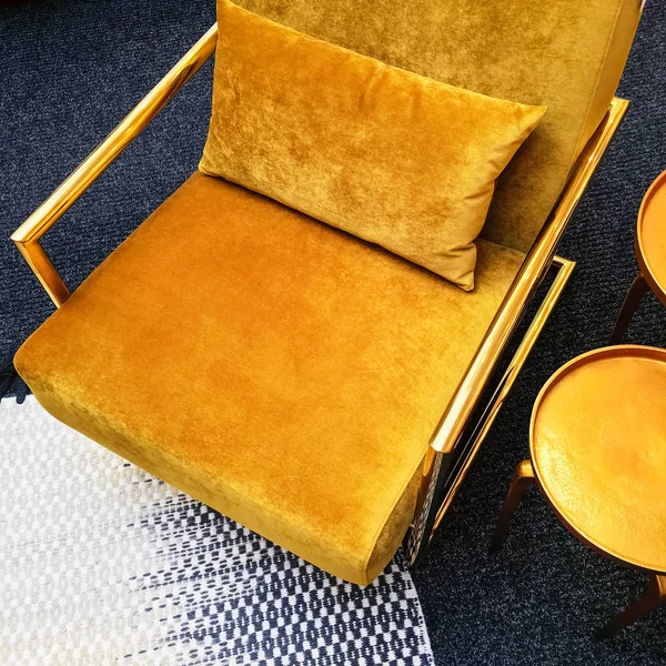 Retro style dark yellow velvet armchair and golden side table — Stock Photo, Image