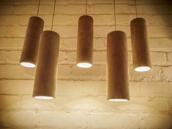 Concrete industrial design lamps in sepia tones — Stock Photo, Image