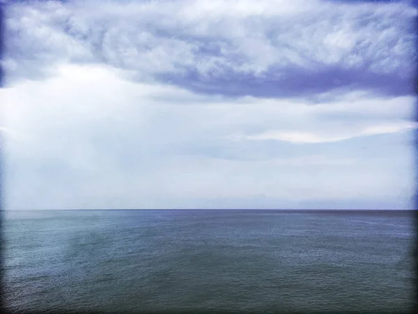 Grungy image of stormy sea and clouds — Stock Photo, Image