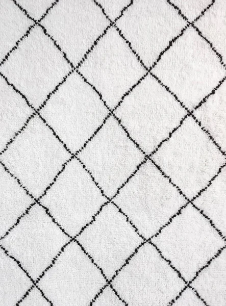 Detail des weißen Teppichs mit schwarzen Linien — Stockfoto