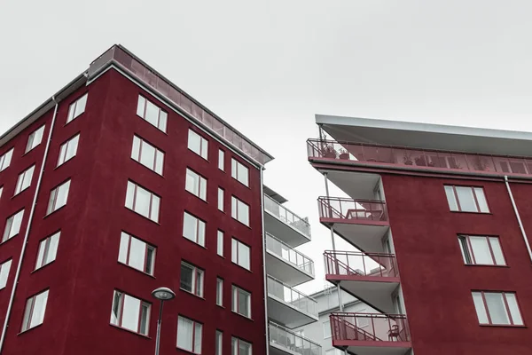 Corners of modern dark red buildings — Stock Photo, Image