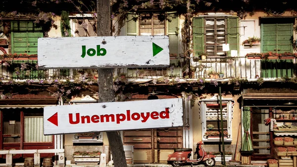 Straatnaambord voor werk versus werklozen — Stockfoto