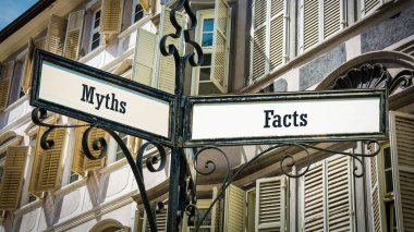 Street Sign the Direction Way to Facts versus Myths clipart