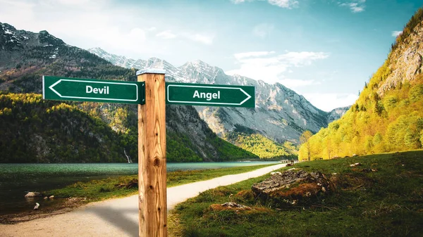 Street Sign the Direction Way to Angel versus Devil