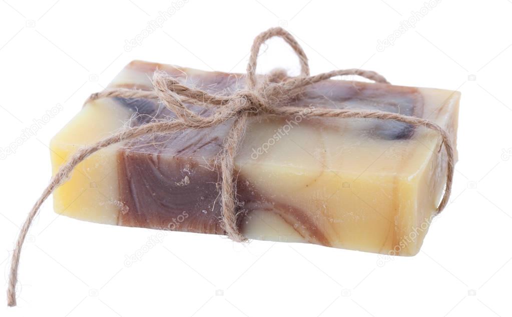 Handmade chocolate chamomile soap isolated on white background