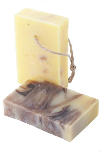 Two handmade chocolate chamomile soaps isolated on white background — Stock Photo, Image