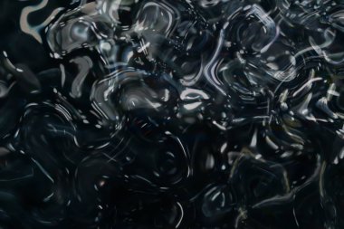 Siyah arkaplanda parlak yansıma sıvısı.