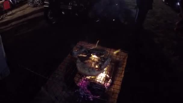 Roast pork on a charcoal stove. — Stock Video