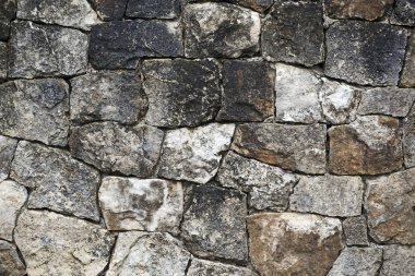 Arka plan dışında alınan renkli eski taş duvar