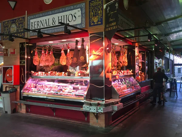 Seville, Spain - November 6, 2017: Meat and charcuterie vendor i