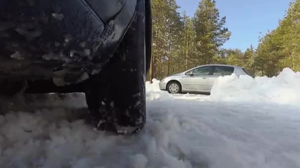Car Wheel Spins Drives Area Snow Shot Throws Snow Camera — Stock Video