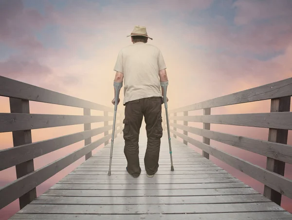 Old man crossing the bridge — Stock Photo, Image