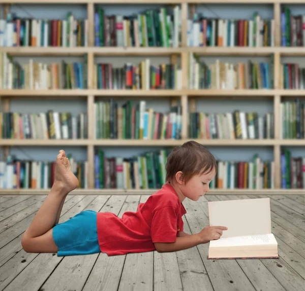 Small reader in library — Stock Photo, Image