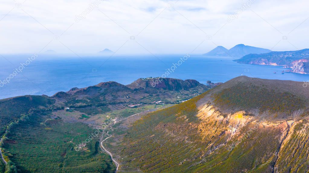 Aerial view photo from flying drone of Amazing grand Vulcano crater with fumaroles on Island of Vulcano, into Lipari ,Eolie Islands. Panoramic View of crater taken Italy, Sicily (series)