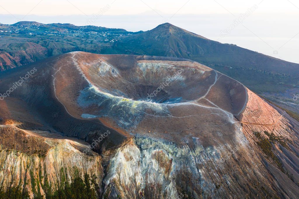 Aerial view photo from flying drone of Amazing grand Vulcano crater with fumaroles on Island at sunset. Of Vulcano, into Lipari ,Eolie Islands. Panoramic View of crater taken Italy, Sicily (series)