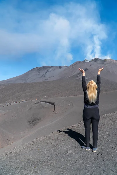 Young Woman Blond Hair Stands Etna Big Volcanic Crater Stretching — Stock Photo, Image