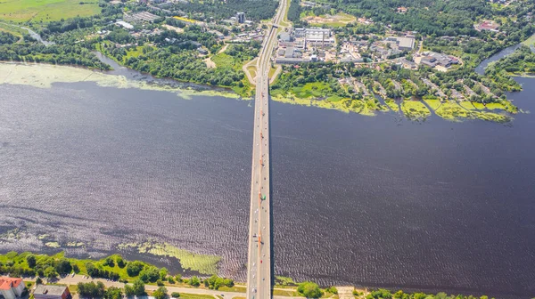 Aerial view photo from flying drone panoramic of the Southern bridge (Dienvidu tilts) on the river Daugava and Riga city background in Riga, Latvia. (series)