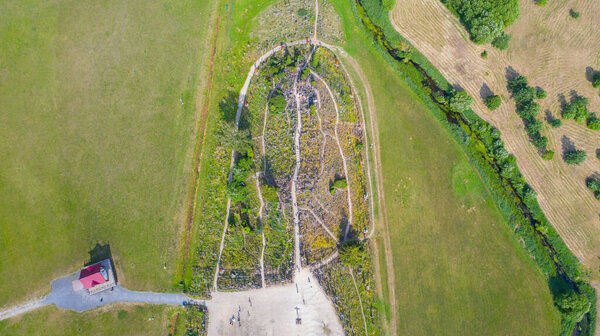 Beautiful Aerial view photo from flying drone panoramic on Hill of Crosses (Kryziu kalnas), a famous site of pilgrimage Siauliai, Lithuania. (series)