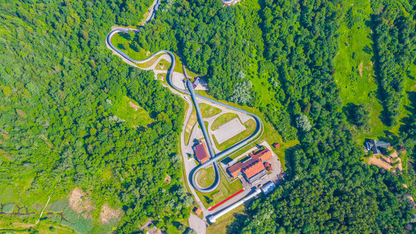 Beautiful panoramic aerial view photo from flying drone on Sigulda Bobsleigh and Luge Track in summer. Sigulda, Latvija (series)