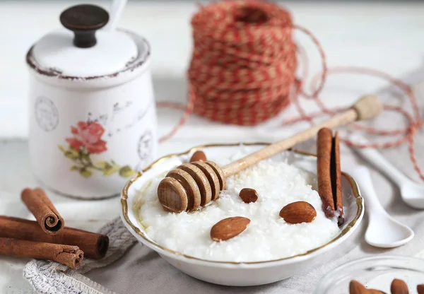 Rice porridge with nuts and honey — Stock Photo, Image