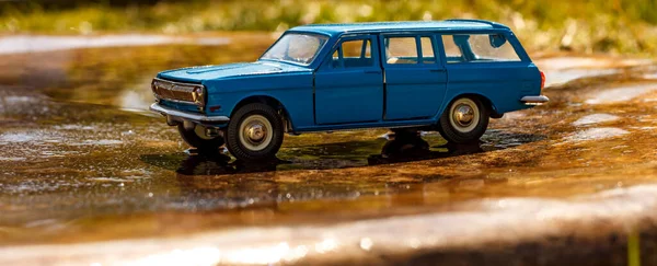Toy Collectible Car Model Blue Size Wet Surface Blurred Background Stock Fotó