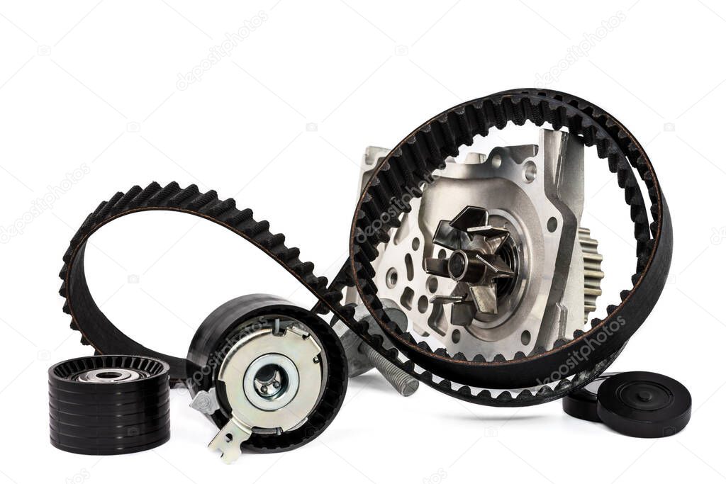Spare parts for the car. The set of timing belt with rollers and cooling pump on a white background.