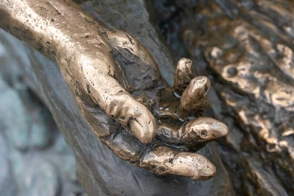 metal hand open and ready to help or receive. Gesture hand hand of statue outstretched for salvation.