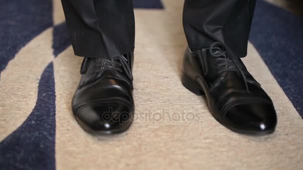 Man flexing new shoes on his feet. close-up — Stock Video