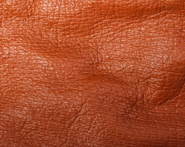 Orange läder i veck bakgrund — Stockfoto