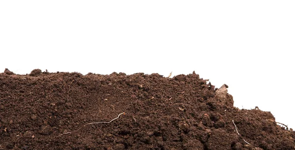 Handful of dark brown soil isolated on white background — Stock Photo, Image