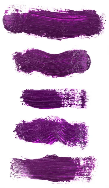 Мазок фиолетовой краски изолирован на белом фоне. Набор — стоковое фото